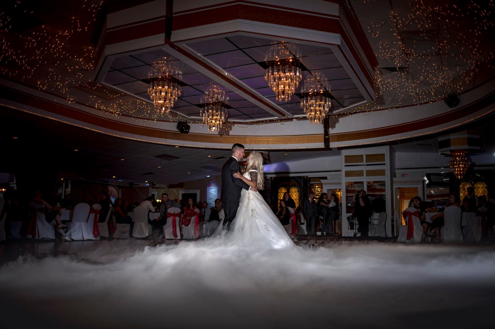 Wedding reception party with uplighting and full dance floor